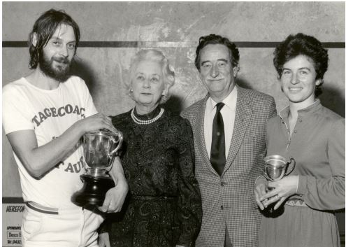 Mrs Symonds, a founder member of Hereford Squash presenting a trophy